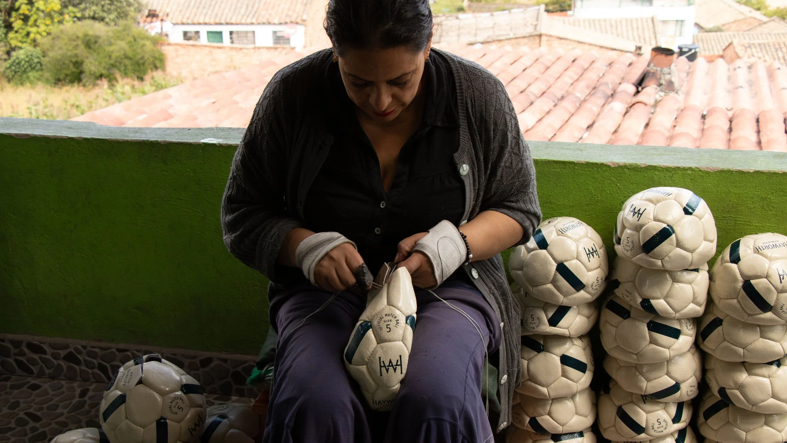 Andean artisan at work constructing a Hayworth soccer ball by hand