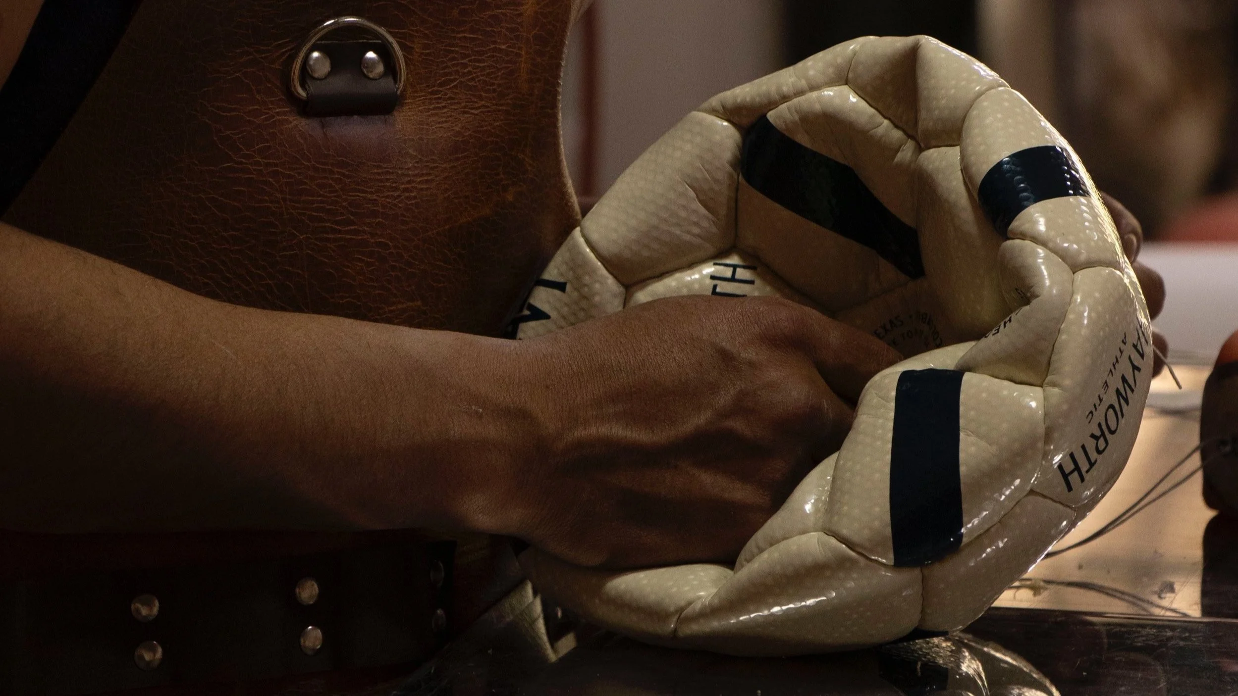 Artisan hand-stitching a Hayworth Athletic soccer ball in the Andean workshop — up to three hours per ball