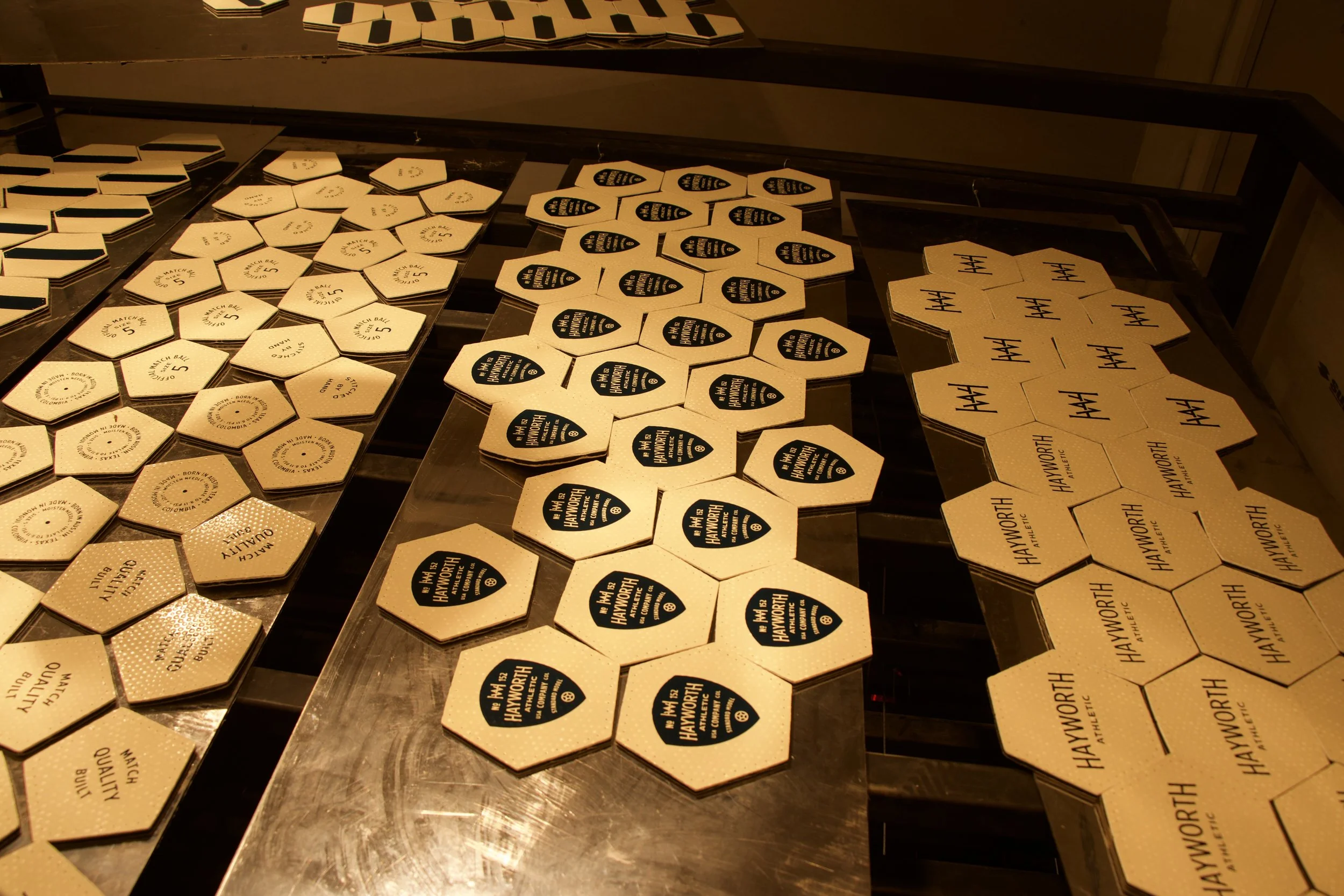 CNC-cut hexagon and pentagon panels for Hayworth soccer ball — precision geometry before hand assembly