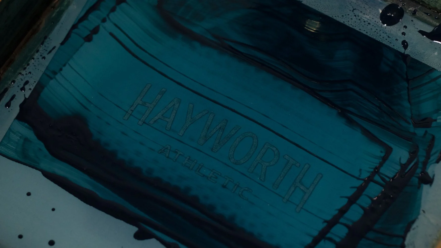 Hand screen-printing a Hayworth Athletic soccer ball with imported scuff-proof paint