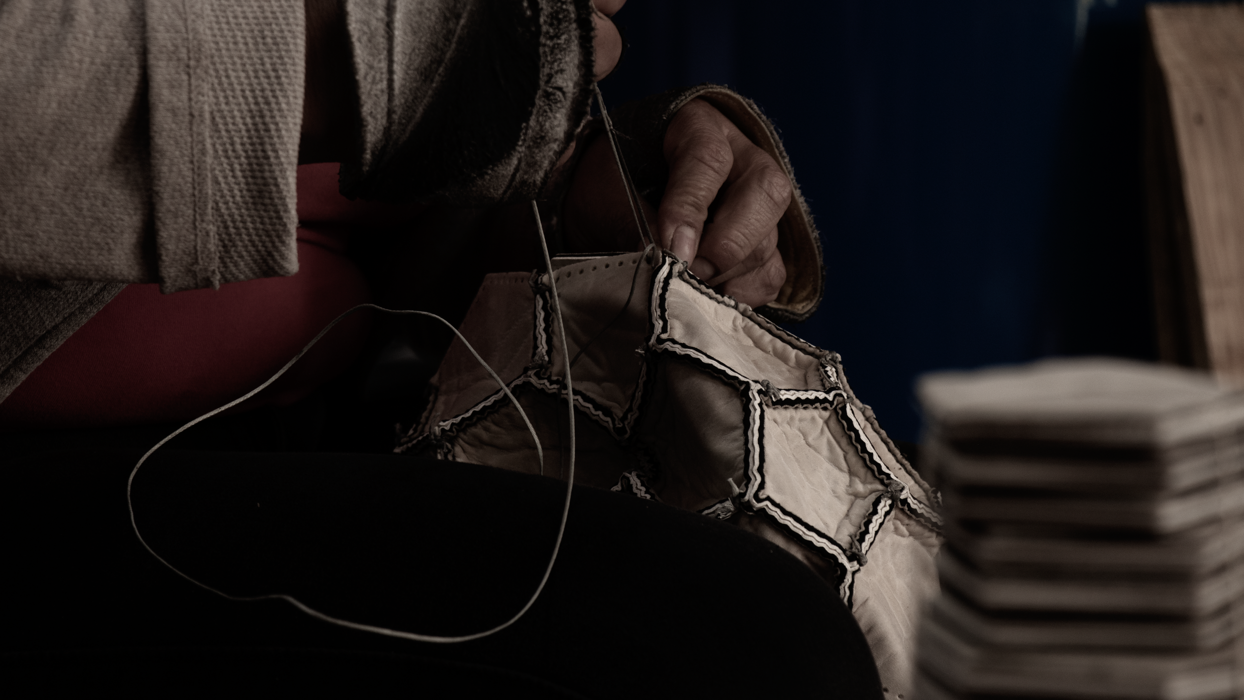 Artisan hand-stitching a Hayworth soccer ball